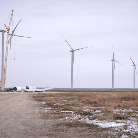 Wind power project site in Odesa region with turbines under assembly, dry winter landscape, no text